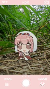  1girl bare_arms beads blue_sky braid brown_eyes brown_sandals chinese_commentary cloak cloud commentary_request day fake_phone_screenshot fake_screenshot grass hair_beads hair_ornament hair_tubes happy highres holding holding_instrument hood hood_up hooded_cloak infinity_nikki instrument knees_apart_feet_together layered_skirt long_skirt looking_at_viewer medium_hair midriff mini_person minigirl nikki_(nikki) nikki_(series) open_mouth pink_hair purifying_wind_(infinity_nikki) red_skirt sandals shirt side_braid single_braid sitting skirt sky sleeveless sleeveless_shirt smile solo tambourine tareme white_cloak white_shirt white_skirt xianmaobuchiyu 