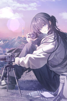  1girl absurdres black_collar black_hair black_pants blue_eyes camera cellphone cloud collar commentary_request highres holding holding_camera hood hoodie knees_up korean_commentary long_hair looking_at_viewer looking_to_the_side novel_illustration official_art on_ground original outdoors pants parted_lips phone purple_sky shoes sitting sky smartphone smile solo tripod turning_head white_hoodie yuhaw0v0 
