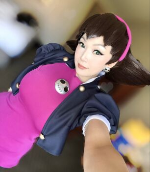 1girl 2026 black_eyes black_jacket blurry blurry_background brown_hair capcom closed_mouth commentary cosplay cosplay_photo cropped_jacket depth_of_field dutch_angle earrings english_commentary foreshortening hairband head_tilt highres jacket jewelry medium_hair mega_man_(series) mega_man_legends_(series) photo_(medium) pink_hairband pink_lips pink_shirt puffy_short_sleeves puffy_sleeves real_life selfie shirt short_sleeves skull_earrings smile tron_bonne_(mega_man) tron_bonne_(mega_man)_(cosplay) vampybitme