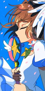  1girl blue_background brown_hair cardcaptor_sakura closed_eyes commentary dress falling_petals feathered_wings from_side highres holding holding_staff hoshi_no_tsue kinomoto_sakura kinomoto_sakura_(astral_sakura) magical_girl minini_(@mofumofu_alien) petals solo staff white_dress white_wings wings 