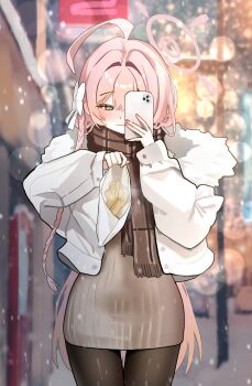  1girl \||/ absurdres ahoge black_pantyhose blue_archive blurry blurry_background braid brown_scarf cellphone commentary depth_of_field food fur-trimmed_jacket fur_trim green_eyes grey_sweater hair_between_eyes halo hanako_(blue_archive) highres holding holding_food holding_phone hyurumari jacket long_hair pantyhose phone pink_hair pink_halo ribbed_sweater scarf single_braid smartphone solo sweater taiyaki taking_picture wagashi white_jacket 