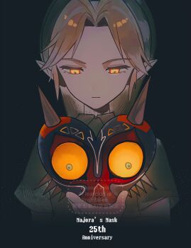  1boy a15179222 anniversary blonde_hair closed_mouth commentary_request copyright_name green_hair green_tunic highres holding holding_mask link majora_(entity) male_focus mask nintendo parted_bangs phrygian_cap pointy_ears short_hair solo the_legend_of_zelda the_legend_of_zelda:_majora's_mask tunic twitter_username upper_body yellow_eyes 