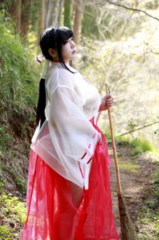  1girl asian bikini black_hair breasts chouzuki_maryou highres japanese_clothes large_breasts lipstick makeup miko photo_(medium) plump see-through_clothes skirt solo swimsuit 