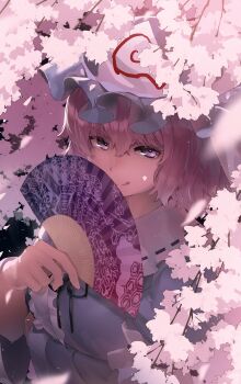  1girl :q arm_under_breasts black_ribbon blue_hat blue_kimono center_frills cherry_blossoms commentary folding_fan frilled_shirt_collar frills goshoguruma hair_between_eyes hand_fan hand_up hat highres holding holding_fan japanese_clothes kimono licking_lips looking_at_viewer mob_cap monosenbei neck_ribbon pink_eyes pink_hair purple_eyes ribbon ribbon-trimmed_collar ribbon_trim saigyouji_yuyuko saigyouji_yuyuko's_fan_design shippou_(pattern) short_hair solo tongue tongue_out touhou triangular_headpiece upper_body wide_sleeves 