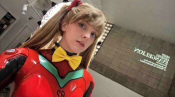  1girl blue_eyes bodysuit bow brazilian_(nationality) breasts brown_hair cosplay dutch_angle hairpods highres indoors interface_headset_(evangelion) lips looking_at_viewer mecha_pilot_suit medium_breasts memepantazis neon_genesis_evangelion photo_(medium) plugsuit_(evangelion) red_bodysuit shiny_clothes smile solo souryuu_asuka_langley souryuu_asuka_langley_(cosplay) twintails two_side_up yellow_bow 