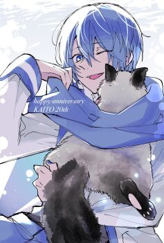  1boy animal blue_eyes blue_hair blue_pants cat character_name coat colorpoint_(pattern) commentary_request cowboy_shot hair_between_eyes happy_anniversary highres holding holding_animal holding_cat kaito_(vocaloid) long_sleeves male_focus one_eye_closed open_mouth pants short_hair siamese_cat sleeve_cuffs smile solo tsuki1 vocaloid white_coat 