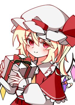  1girl ascot blonde_hair blush box capelet christmas closed_mouth collared_shirt commentary_request crystal crystal_wings flandre_scarlet frilled_shirt_collar frills gift gift_box hat hat_ribbon highres holding holding_gift illust_atelier3 looking_at_viewer mob_cap multicolored_wings one-hour_drawing_challenge one_side_up red_capelet red_eyes red_skirt red_vest ribbon shirt simple_background skirt skirt_set smile solo touhou vest white_background white_hat white_shirt wings yellow_ascot 