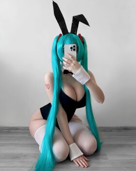  1girl blue_hair breasts cosplay hair_ornament hatsune_miku_(cosplay) highres large_breasts long_hair presenting rabbit rabbit_ears real_life selfie sexually_suggestive solo  rating:Explicit score:49 user:ahegahotwhorespa