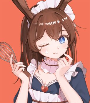  1girl ;q amiya_(arknights) apron arknights black_shirt blue_eyes blush breasts brown_hair closed_mouth commentary cream food food_on_face frills hands_up highres holding holding_whisk long_hair looking_at_viewer maid_headdress omuretu_(butterroru) one_eye_closed orange_background shirt simple_background small_breasts solo tongue tongue_out whisk white_apron 