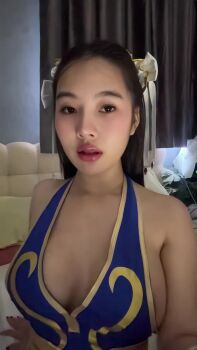  1girl animated asian blue_dress bodysuit breasts brown_hair capcom china_dress chinese_clothes chun-li chun-li_(cosplay) collarbone cosplay cosplay_photo dress female_focus grabbing_own_breast hair_bun hair_ribbon highres indoors jennycosplay long_hair looking_at_viewer nipples official_alternate_costume photo_(medium) pink_lips real_life red_nails ribbon solo street_fighter street_fighter_iv_(series) video yellow_hair_ribbon yellow_ribbon  rating:Questionable score:60 user:MadGasher