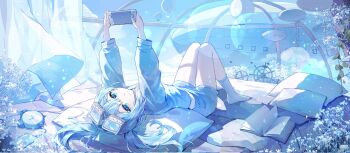  1girl aircraft arahashi_tabi blue_eyes blue_hair book clock closed_mouth cloud commentary_request curtains dirigible goggles goggles_on_head highres hot_air_balloon korean_commentary lens_flare lying nintendo_switch on_back pillow plant ship's_wheel shirt shorts sky socks solo steering_wheel stellive twintails umji_11 virtual_youtuber white_socks 
