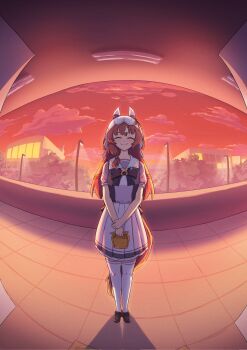  1girl animal_ears bow brown_hair brown_shoes building closed_eyes cloud commentary ear_covers english_commentary fisheye full_body highres holding horse_ears horse_girl horse_tail lamppost pleated_skirt red_sky ruuwak sailor_collar school_uniform shirt shoes short_sleeves skirt sky smile standing still_in_love_(umamusume) tail thighhighs tracen_school_uniform umamusume veil white_thighhighs white_veil 