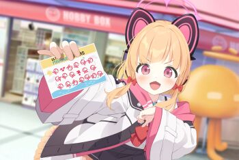 1girl animal_ear_headphones animal_ears arm_up blonde_hair blue_archive blurry blurry_background blush bow card cat_ears fake_animal_ears game_asset hair_bow halo headphones highres holding holding_card hood hood_down hoodie jacket looking_at_viewer momoi_(blue_archive) non-web_source official_art open_mouth outdoors outstretched_arm pink_eyes pink_halo pink_hoodie red_bow school_uniform self-datamine short_hair sidelocks smile storefront white_jacket yutokamizu