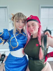 Rule 34 | 2girls, bare shoulders, blue eyes, braid, cammy white, cammy white (cosplay), capcom, china dress, chinese clothes, chun-li, chun-li (cosplay), cosplay, curvy, dress, hand on own hip, hat, highleg, highleg leotard, highres, hug, indoors, jessicatalystic, leotard, long hair, looking at viewer, multiple girls, musclemommycosplay, photo (medium), pink hair, real life, shiny clothes, skindentation, sleeveless, smile, standing, standing on one leg, street fighter, twin braids, wide hips
