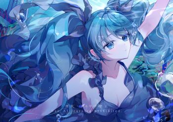 1girl arm_up bare_shoulders blue_eyes blue_hair blue_theme blush breasts bubble cleavage collarbone commentary_request dress hair_between_eyes hair_ornament hatsune_miku highres long_hair looking_at_viewer medium_breasts official_alternate_costume open_mouth shinkai_shoujo_(vocaloid) sleeveless sleeveless_dress solo syana_alice twintails underwater very_long_hair vocaloid