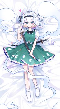 1girl absurdres bare_legs bed_sheet black_bow black_bowtie black_hairband blush bow bowtie collared_shirt commentary dakimakura_(medium) flower frilled_skirt frills full_body green_eyes green_skirt green_vest hair_bow hairband heart highres hitodama hitodama_print holding holding_sword holding_weapon konpaku_youmu konpaku_youmu_(ghost) lying no_nose no_shoes on_back parted_lips puffy_short_sleeves puffy_sleeves scabbard sheath shirt short_hair short_sleeves sia_6767 skirt skirt_set socks solo sword touhou vest weapon white_hair white_shirt white_socks