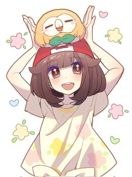 1girl beanie black_hair floral_print flower gen_7_pokemon hat heart highres nintendo on_head poke_ball_theme pokemon pokemon_(creature) pokemon_on_head pokemon_sm red_hat rowlet selene_(pokemon) shirt shocho_(shaojiujiu) short_hair t-shirt tied_shirt white_background yellow_shirt