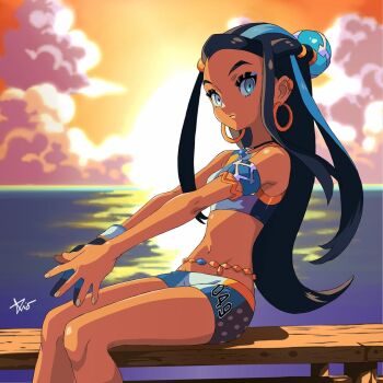 1girl bare_shoulders black_hair blue_eyes blue_hair crop_top dark-skinned_female dark_skin earrings gloves jewelry looking_at_viewer midriff nessa_(pokemon) nintendo pokemon pokemon_swsh rio_chico_art shorts single_glove sitting sleeveless sunset swimsuit