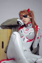 Rule 34 | 1girl, arm support, ass, blue eyes, bodysuit, brazilian (nationality), breasts, brown hair, cosplay, crossed legs, evangelion: 3.0+1.0 thrice upon a time, eyepatch, eyepatch lift, freckles, highres, interface headset, light smile, lips, looking at viewer, memepantazis, neon genesis evangelion, photo (medium), plugsuit, portrait, rebuild of evangelion, shiny clothes, solo, souryuu asuka langley, souryuu asuka langley (cosplay), standing, twintails, two side up, white bodysuit
