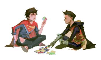 2boys batman_(series) belt black_hair blue_eyes cape card card_game child commentary damian_wayne dark-skinned_male dark_skin dc_comics english_commentary full_body gloves green_eyes green_gloves highres holding holding_card jonathan_kent male_focus multiple_boys open_mouth playing_card playing_games robin_(dc) simple_background sitting super_sons superboy superhero_costume superman_(series) torn_clothes uno_(game) utility_belt wdyean white_background