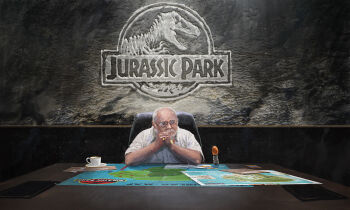 1boy amber_(gemstone) balding beard cane chair commentary cup edouard_groult english_commentary english_text facial_hair gem glass glasses grey_hair highres john_hammond jurassic_park looking_to_the_side map map_(object) mustache office_chair own_hands_clasped own_hands_together reflection saucer shirt sleeves_rolled_up solo swivel_chair teacup white_shirt