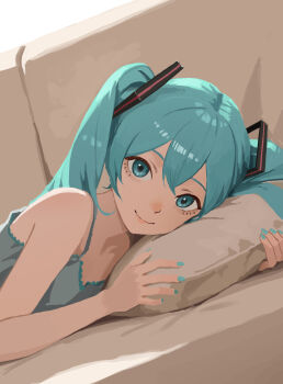 1girl aqua_hair aqua_nails bare_arms bare_shoulders camisole commentary_request couch grey_camisole hair_ornament hatsune_miku highres hugging_object lips long_hair looking_at_viewer lying on_couch pillow pillow_hug sleeveless smile soda_log solo spaghetti_strap twintails upper_body very_long_hair vocaloid
