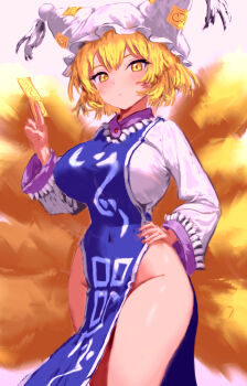 1girl :o absurdres bare_hips blonde_hair blue_tabard blush breasts covered_navel expressionless flandzen fox_girl fox_tail hair_between_eyes hand_on_own_hip hat highres holding holding_ofuda kitsune kyuubi large_breasts long_sleeves looking_at_viewer medium_hair multiple_tails no_panties ofuda pelvic_curtain shirt solo tabard tail thighs touhou white_shirt yakumo_ran yellow_eyes