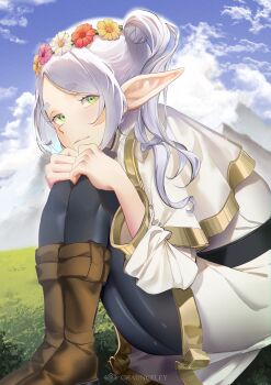 1girl absurdres artist_name black_pantyhose boots brown_boots chaunceley closed_mouth cloud commentary elf english_commentary flower flower_wreath frieren grass green_eyes highres orange_flower pantyhose pink_flower pointy_ears sitting sky solo sousou_no_frieren white_flower yellow_flower