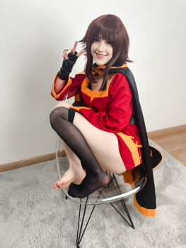 Rule 34 | 1girl, absurdres, barefoot, belt, black cape, black gloves, black thighhighs, blunt bangs, blush, breasts, brown hair, cape, carpet, chair, cosplay, cosplay photo, dress, feet, fingerless gloves, floor, full body, gloves, grin, highres, kono subarashii sekai ni shukufuku wo!, long sleeves, looking at viewer, megumin, megumin (cosplay), photo (medium), red dress, red eyes, sidelocks, single thighhigh, sitting, small breasts, smile, soles, solo, stelarhoshi, teeth, thighhighs, upper teeth only, wall