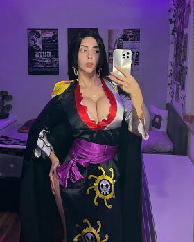 1girl boa_hancock boa_hancock_(cosplay) breasts cleavage cosplay eliza_deniz huge_breasts one_piece phone real_life