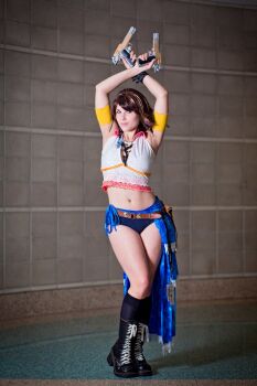 armpits arms_up boots brown_hair cosplay cosplay_photo final_fantasy final_fantasy_x final_fantasy_x-2 gun heterochromia highres jsica_(cosplay_deviants) midriff navel photo_(medium) platform_boots weapon yuna yuna_(ff10) yuna_(ff10)_(cosplay)