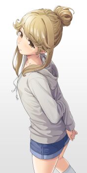 1girl arms_behind_back blush brown_eyes brown_hair commentary_request denim denim_shorts gradient_background grey_hoodie hair_bun highres hood hoodie idolmaster idolmaster_million_live! long_hair looking_to_the_side revision short_shorts shorts sidelocks single_hair_bun smile solo tenkuubashi_tomoka yoropa