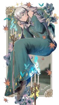 1boy animal_print blue_fire border brown_shoes butterfly_print candle cloak commentary dress english_commentary fire green_dress green_eyes grey_cloak grey_hair hair_between_eyes highres hood hooded_cloak long_dress looking_at_viewer male_focus octopath_traveler octopath_traveler_ii ornate_border outside_border shoes short_hair solo sparkle temenos_mistral u_arca_u white_border