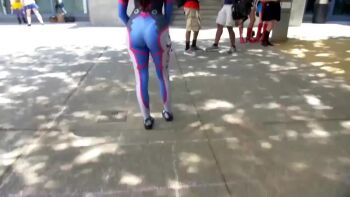 Rule 34 | 1girl, animated, bodysuit, brown hair, cosplay, d.va (overwatch), facepaint, gun, outdoors, overwatch, tagme, tight clothes, vamplette, video, weapon, wig