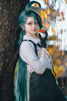 1girl 2025 absurdres androgynous asian black_gloves black_necktie black_pants closed_mouth collarbone collared_shirt commentary cosplay cosplay_photo cowboy_shot cowlick day ear_piercing earrings female_focus forest gloves high-waist_pants highres holding holding_poke_ball horiuchi_cos japanese_(nationality) jewelry leaning_back long_hair long_sleeves looking_at_viewer low_ponytail nature necktie nintendo pale_skin pants photo_(medium) piercing poke_ball poke_ball_(basic) pokemon pokemon_sv ponytail popped_collar real_life red_eyes reverse_trap rika_(pokemon) rika_(pokemon)_(cosplay) shirt smile solo very_long_hair white_shirt