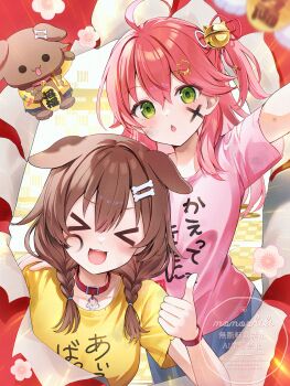 >_< 2girls :3 :o alternate_costume animal_ears artist_name bell belt_collar blue_shorts blush body_writing bone_hair_ornament braid brown_eyes brown_hair cat_hair_ornament clothes_writing collar commentary dog_ears dog_girl facepaint facing_viewer fangs green_eyes hair_bell hair_between_eyes hair_ornament hair_ribbon hairclip highres hololive inugami_korone inugami_korone_(dog) long_hair looking_at_viewer momoshiki_tsubaki multiple_girls one_side_up open_mouth pink_hair pink_shirt red_ribbon ribbon sakura_miko shirt shorts symbol-only_commentary teeth thumbs_up twin_braids upper_teeth_only virtual_youtuber wristband yellow_shirt