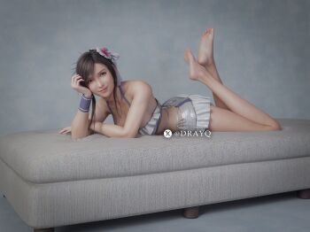 1girl 3d artist_name barefoot bikini black_hair breasts closed_mouth costa_del_sol couch drayqin feet feet_up final_fantasy final_fantasy_vii final_fantasy_vii_rebirth final_fantasy_vii_remake flower frilled_bikini frills full_body hair_flower hair_ornament highres indoors large_breasts legs looking_at_viewer lying on_couch on_stomach sidelocks smile soles solo swimsuit the_pose tifa_lockhart tifa_lockhart_(shining_spirit) toes twitter_username white_bikini