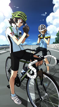 2boys aoyagi_hajime bicycle bicycle_helmet bike_shorts black_hair blonde_hair blue_sky bottle cloud curly_hair day fingerless_gloves glove_pull gloves hair_over_one_eye helmet highres kyakya lens_flare long_hair looking_at_another looking_at_viewer multiple_boys railing road shoes sky smile sneakers socks sportswear standing teshima_junta vanishing_point water_bottle yowamushi_pedal