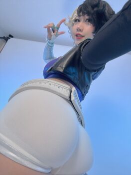 1girl 2025 _gloves asian ass asymmetrical_gloves belt black_hair black_jacket blue_eyes blue_nails border breasts choker cleavage collarbone cosplay cosplay_photo crop_top cropped_jacket danisaurz earrings female_focus fingerless_gloves foreshortening from_behind from_below full_body gloves grin hair_between_eyes hashtag-only_commentary heterochromia highres indoors jacket jewelry looking_at_viewer looking_back luna_snow luna_snow_(cosplay) marvel marvel_rivals midriff mismatched_gloves multicolored_hair multiple_rings navel open_clothes open_jacket outstretched_arm parted_hair partially_fingerless_gloves photo_(medium) purple_eyes real_life red_lips ring short_hair short_shorts shorts sideboob sidelocks skindentation smile solo split-color_hair thick_lips two-tone_hair v wedge_heels white_belt white_border white_choker white_gloves white_hair white_shorts