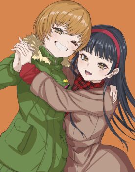 2girls amagi_yukiko black_hair brown_coat brown_eyes brown_hair checkered_clothes checkered_scarf coat commentary fur-trimmed_jacket fur_trim green_jacket grin hairband hand_on_another&#039;s_shoulder highres holding_hands interlocked_fingers jacket light_blush long_hair long_sleeves looking_at_viewer multiple_girls one_eye_closed open_mouth orange_background persona persona_4 red_hairband red_scarf s-m-53413 satonaka_chie scarf short_hair smile upper_body winter_clothes