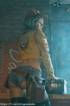 1girl ass belt bikini bikini_under_clothes blonde_hair breasts cidney_aurum cidney_aurum_(cosplay) cosplay denim denim_shorts final_fantasy final_fantasy_xv green_eyes hat highres jacket photo_(medium) shirogane-sama short_shorts shorts swimsuit tool_belt toolbox tools