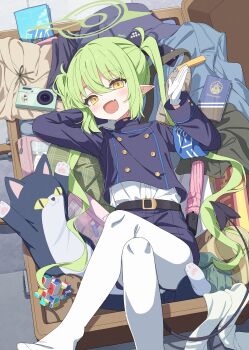 1girl :d absurdres blue_archive blush commentary crossed_legs demon_tail fang from_above green_hair green_halo halo highres in_container long_hair long_sleeves looking_at_viewer lying no_shoes nozomi_(blue_archive) on_back open_mouth open_suitcase pantyhose school_uniform seero skin_fang smile solo suitcase tail very_long_hair wavecat_(blue_archive) white_pantyhose yellow_eyes