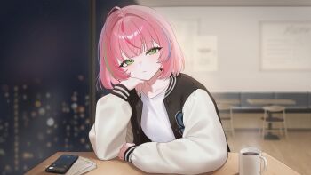 1girl absurdres cellphone cityscape coffee coffee_mug commentary_request cup green_eyes hand_on_own_head highres indoors jacket korean_commentary korean_text letterman_jacket medium_hair mug mumu_muw night original phone pink_hair smartphone solo squinting