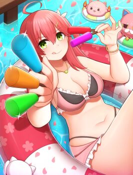 1girl ahoge atorie bare_shoulders bikini blush bracelet breasts cleavage closed_mouth collarbone commentary_request falling_petals food frilled_bikini frills gold_bracelet green_eyes hair_between_eyes highres holding holding_food holding_popsicle hololive innertube jewelry kintoki_(sakura_miko) long_hair looking_at_viewer medium_breasts navel necklace petals pink_bikini pink_hair pink_petals popsicle sakura_miko smile stomach swim_ring swimsuit tongue tongue_out water