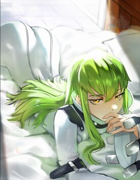 1girl ass bodysuit c.c. code_geass commentary english_commentary green_hair highres long_hair looking_at_viewer lying on_stomach solo waligner white_bodysuit yellow_eyes