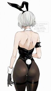 1girl 2b_(nier:automata) animal_ears armband ass back bare_shoulders black_armband black_gloves black_hairband black_leotard commentary_request detached_collar feet_out_of_frame fishnet_pantyhose fishnets from_behind gloves grey_hair hairband highres leotard nier:automata nier_(series) nishiii26miii pantyhose rabbit_ears rabbit_tail shiny_clothes short_hair simple_background solo tail thigh_gap twitter_username wrist_cuffs