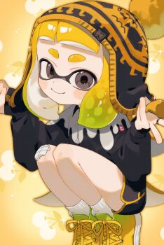 Rule 34 | 1girl, beanie, black hat, black shorts, blonde hair, closed mouth, cross-laced shoes, dolphin shorts, grey eyes, hat, highres, inkling, inkling girl, inkling player character, looking at viewer, medium hair, nintendo, print hat, sabata saba, shoes, shorts, smile, solo, sparkle, splatoon (series), splatoon 3, squatting, tentacle hair, thick eyebrows, yellow background, yellow shoes