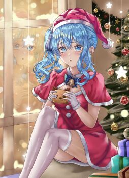 1girl :o bell blue_bow blue_bowtie blue_eyes blue_hair bow bowtie capelet christmas christmas_ornaments christmas_present christmas_tree clyriie dress food fur_trim gift hat highres holding holding_food hololive hoshimachi_suisei jingle_bell looking_at_viewer neck_bell reflection santa_costume santa_dress santa_hat side_ponytail sitting solo star_(symbol) star_in_eye symbol_in_eye thighhighs virtual_youtuber window