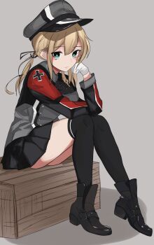 1girl anchor_hair_ornament black_skirt blonde_hair blue_eyes blush boots box breasts cross gloves hair_ornament hat highres iron_cross kantai_collection large_breasts long_hair long_sleeves looking_at_viewer low_twintails military_uniform miron_(mirona33) peaked_cap prinz_eugen_(kancolle) sitting skirt solo thighhighs twintails white_gloves