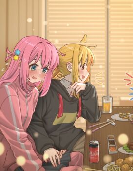 2girls ahoge artist_name black_hoodie black_skirt blonde_hair blue_eyes blush bocchi_the_rock! can casual chopsticks coca-cola commentary cube_hair_ornament drink drink_can english_commentary film_grain fingernails food from_side glass gotoh_hitori hair_ornament highres holding_hands hood hoodie ijichi_nijika indoors jacket long_hair long_sidelocks long_sleeves multiple_girls myvia_mokols nose_blush open_mouth pink_hair pink_jacket pleated_skirt red_eyes side_ponytail sidelocks sideways_mouth sitting skirt smile soda_can straight_hair table talking track_jacket twitter_username yuri